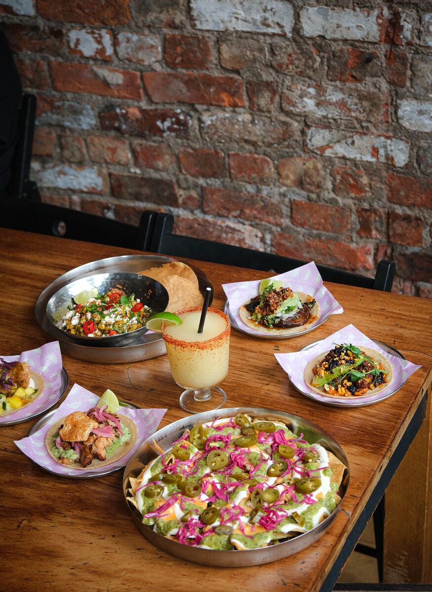 A catering spread of tacos, nachos and margaritas