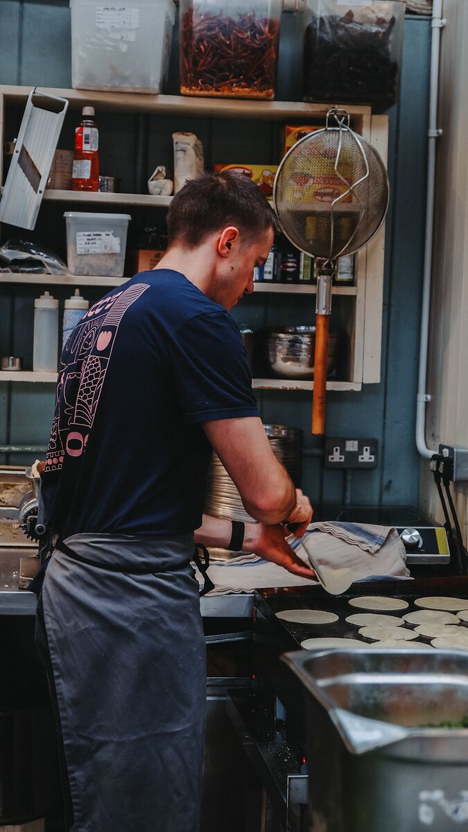 Tortillas cooking on the plancha — see this on our Instagram